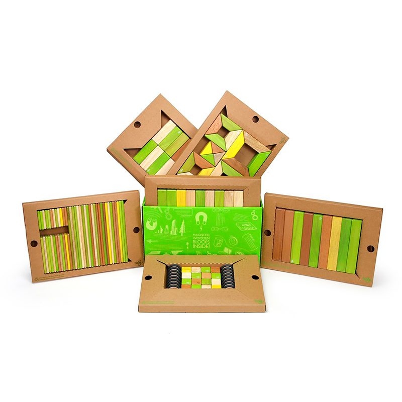 Wooden geometric blocks set with green and brown colors on a white background