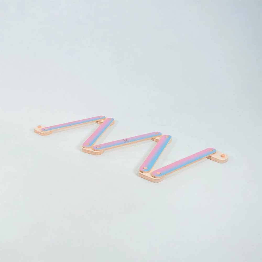 pink and blue gradient balance beam on a light gray background