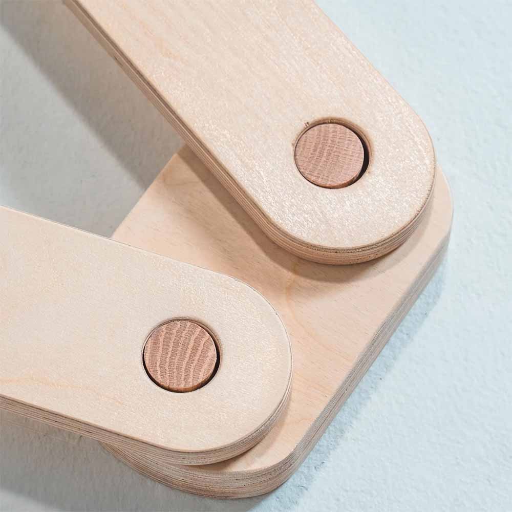 Wooden balance beam joints on a light blue background