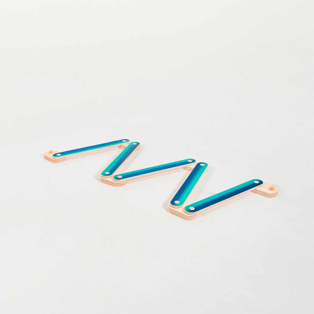 blue hued balance beam on a light gray background