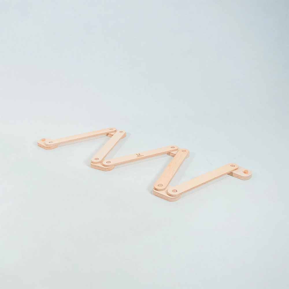 Wooden balance beam on a light background