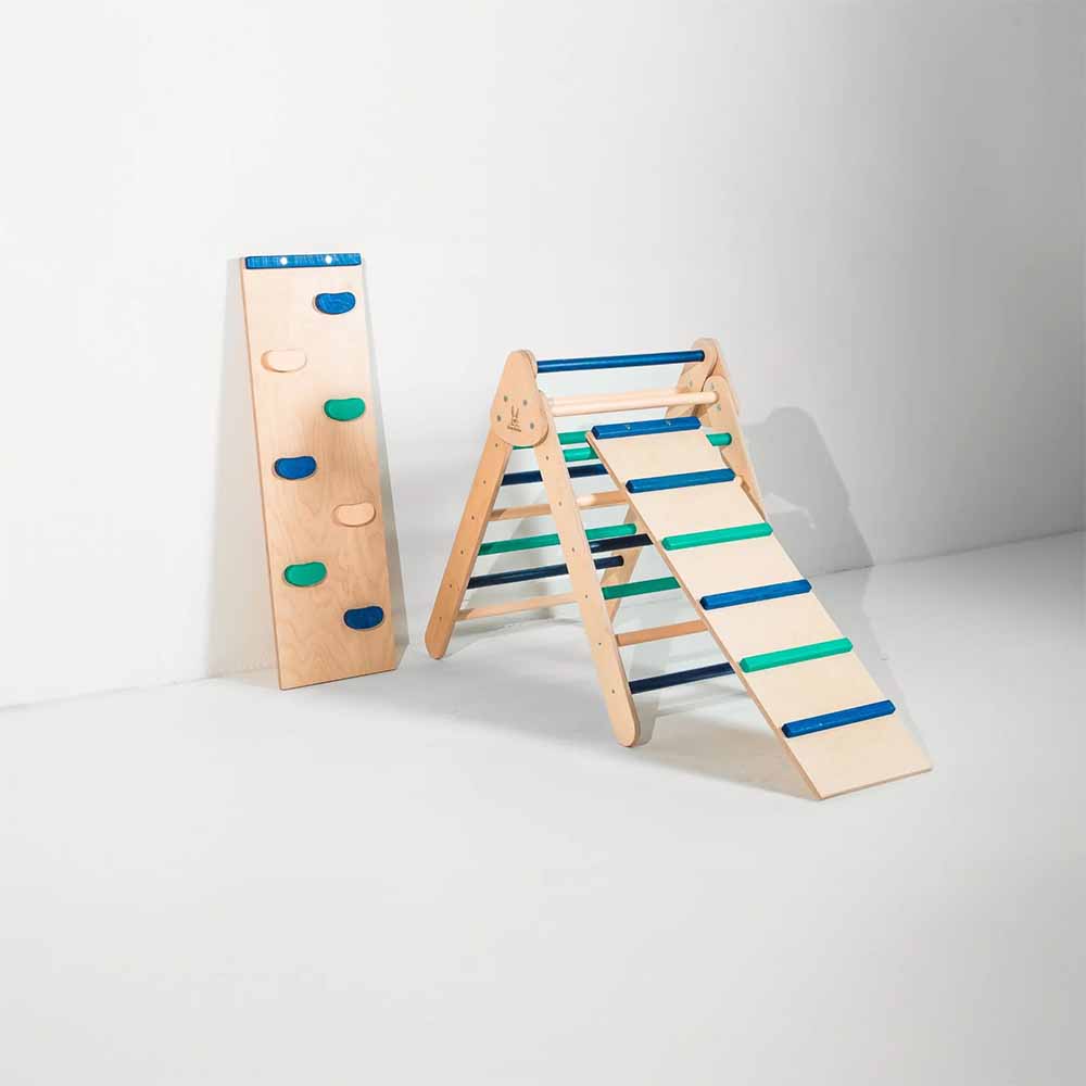 Wooden climbing toy with a slide on a white background