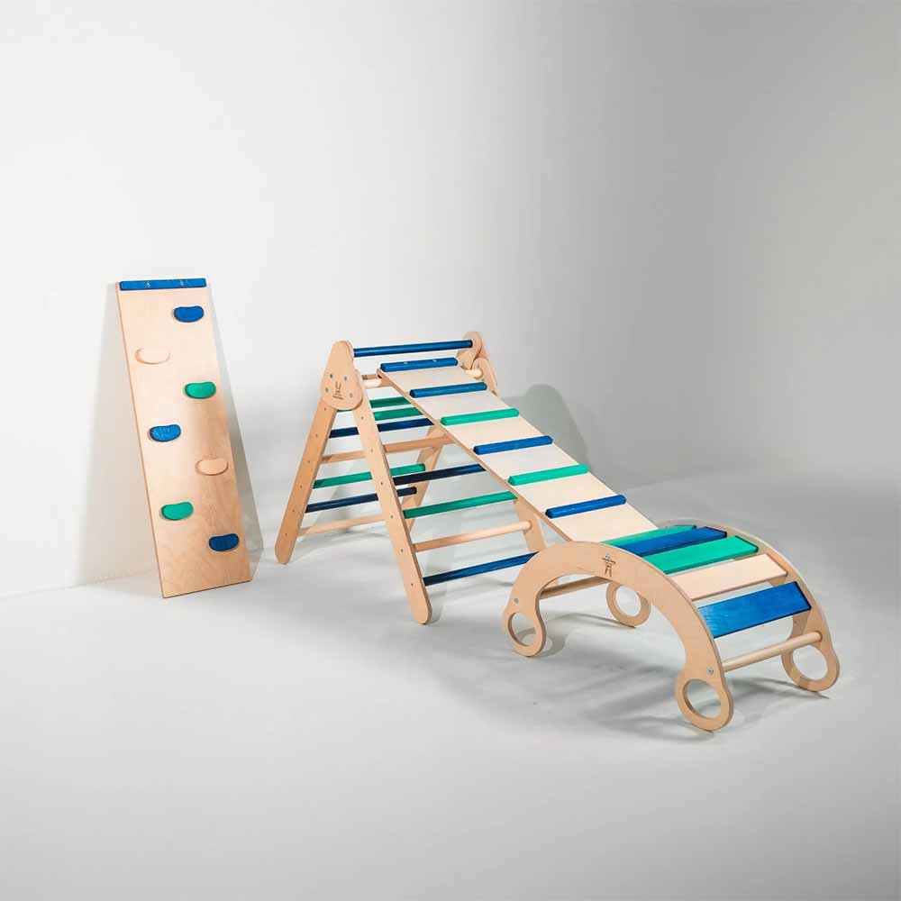 Wooden climbing toy with colorful steps on a gray background