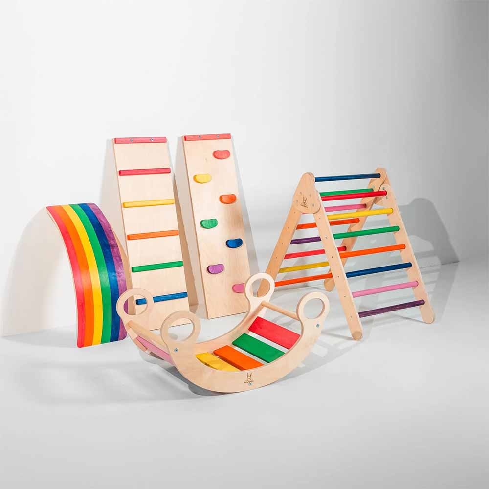 Set of colorful wooden climbing toys on a white background