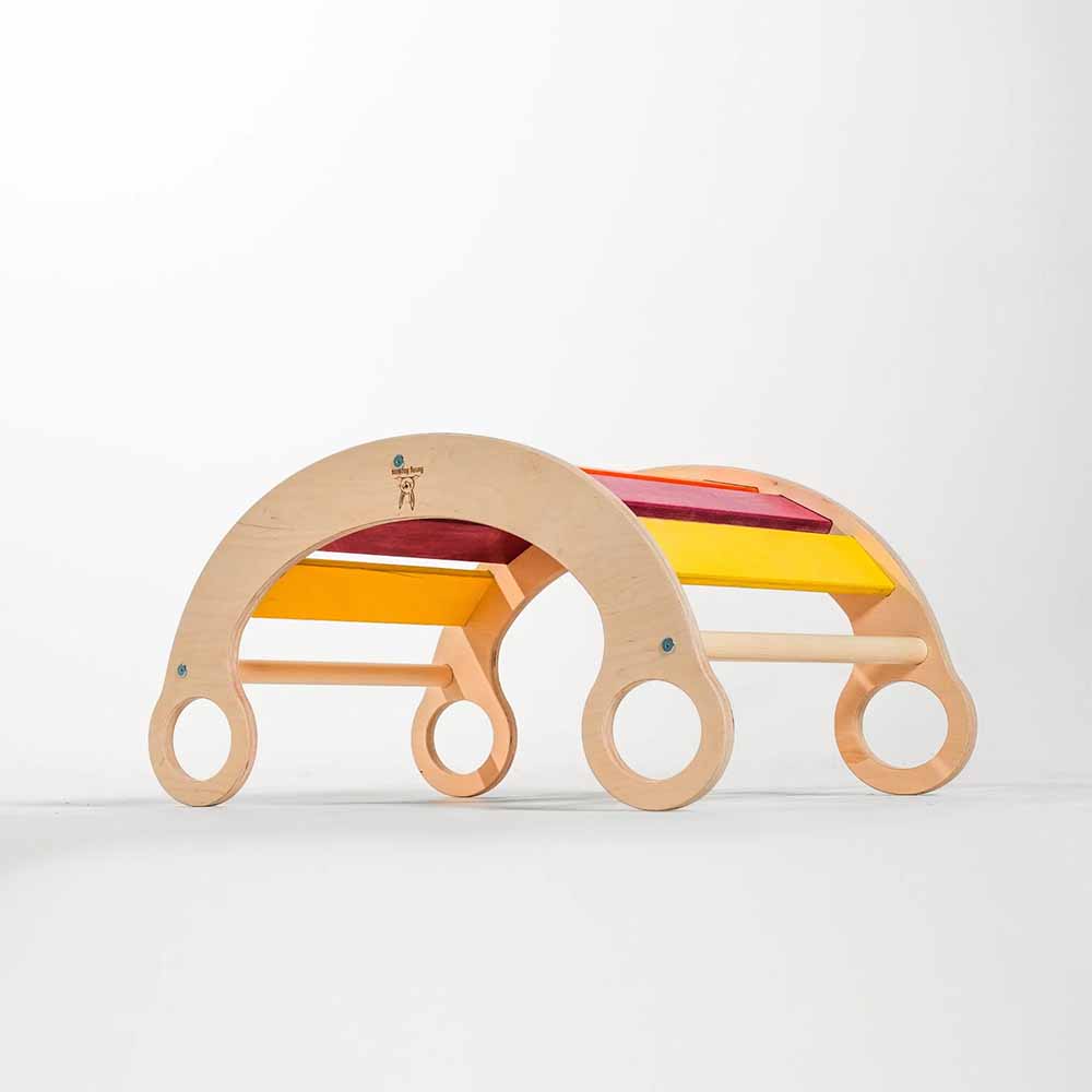 Wooden toy with colorful arches on a white background