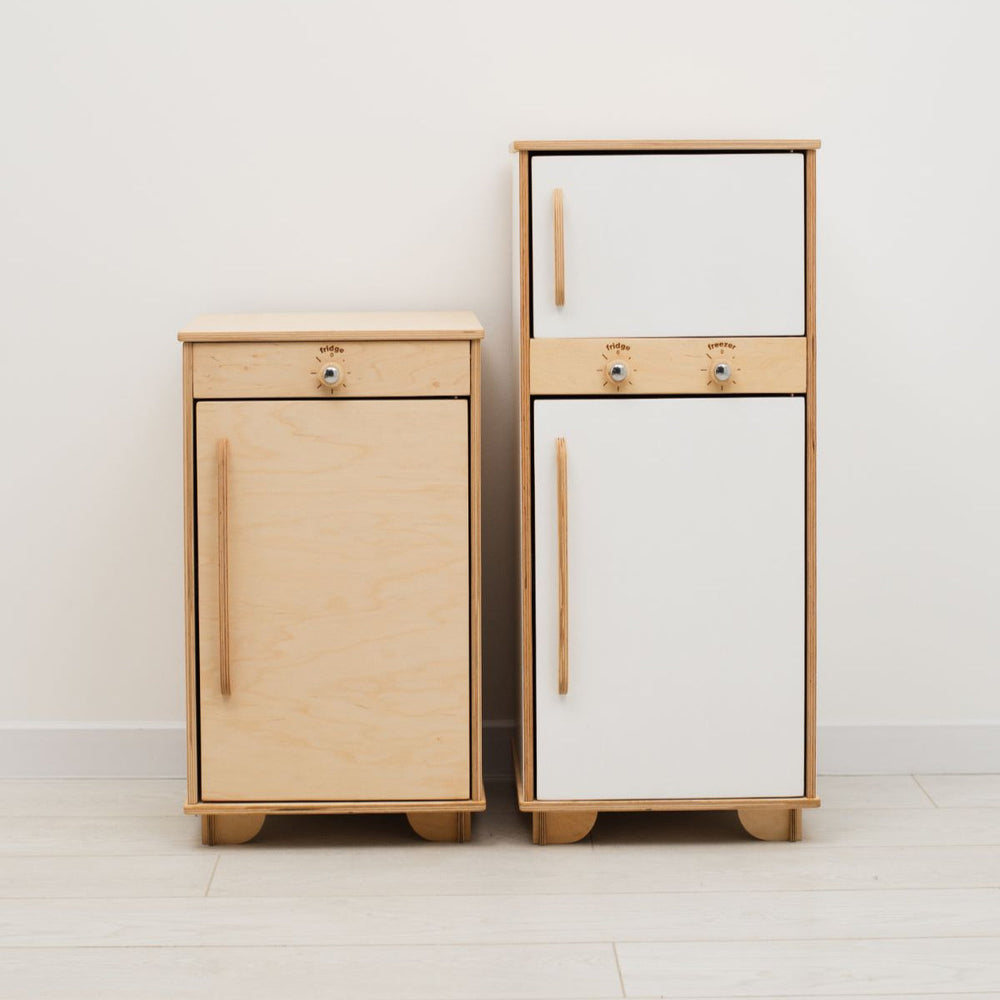 Two wooden cabinets, one light wood and one white, on a plain background