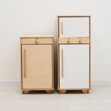 Two wooden cabinets, one light wood and one white, on a plain background