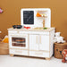 Children's play kitchen set with oven, sink, and shelves against a brown wall.
