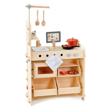 Wooden play kitchen set with various accessories on a white background