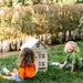 Little_Forest_Animals_House_Of_San_Francisco_Dollhouse_Outside_With_Smiling_Child