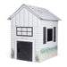 White toy house with black accents on a white background