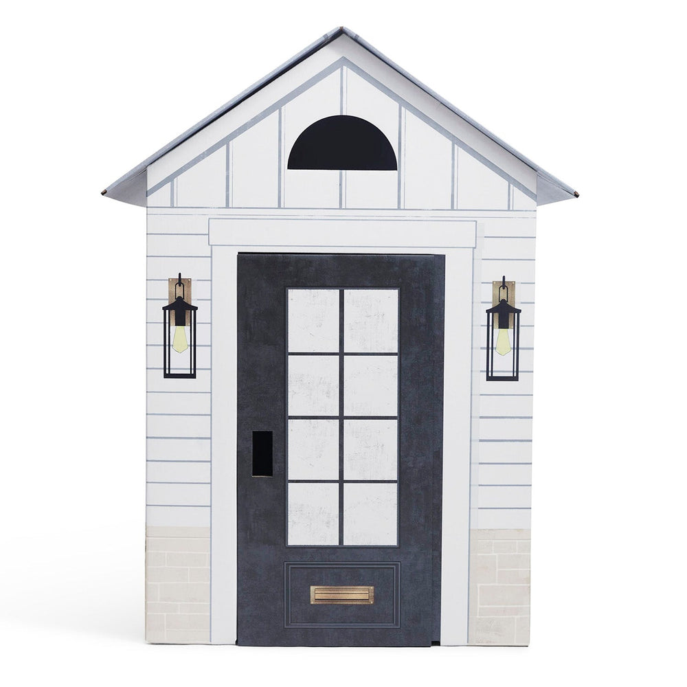 White playhouse with a black door and windows on a white background