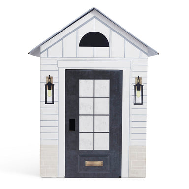 White playhouse with a black door and windows on a white background