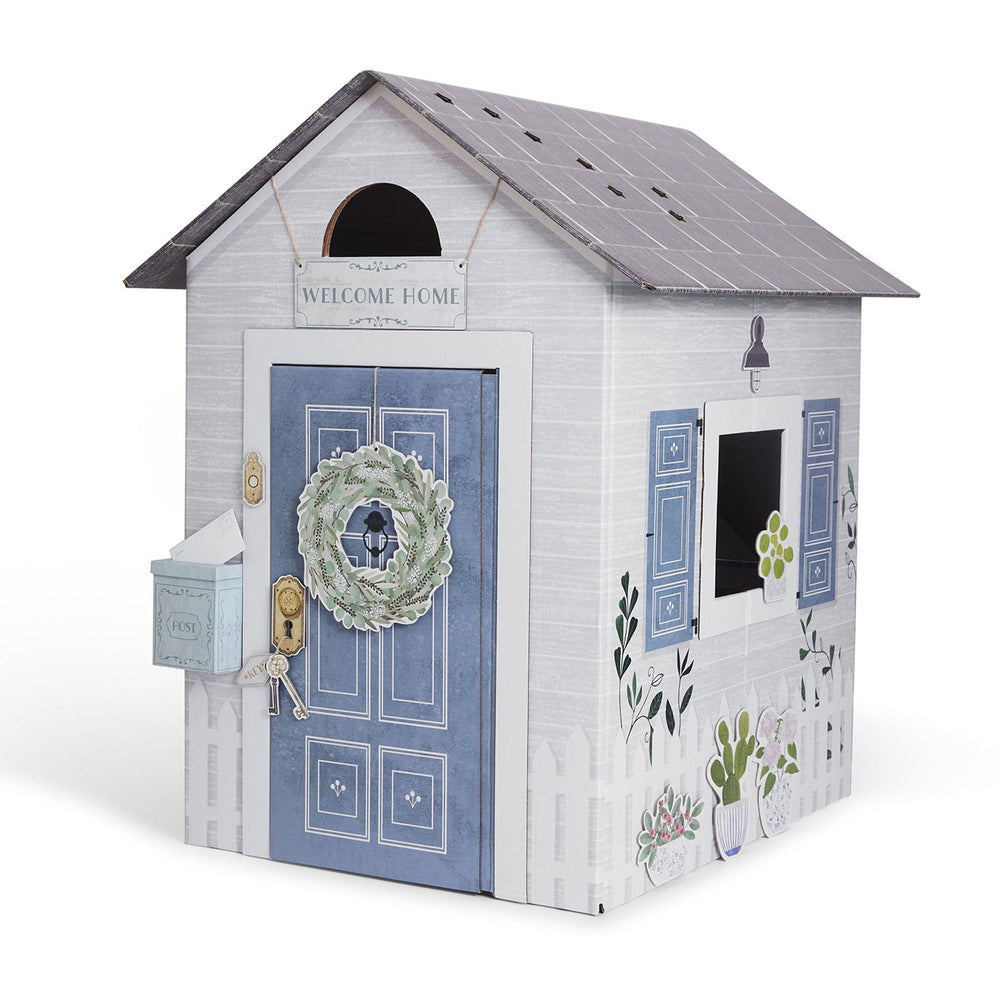 Playhouse with a blue door and decorative elements on a white background