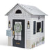Playhouse with decorative elements on a white background
