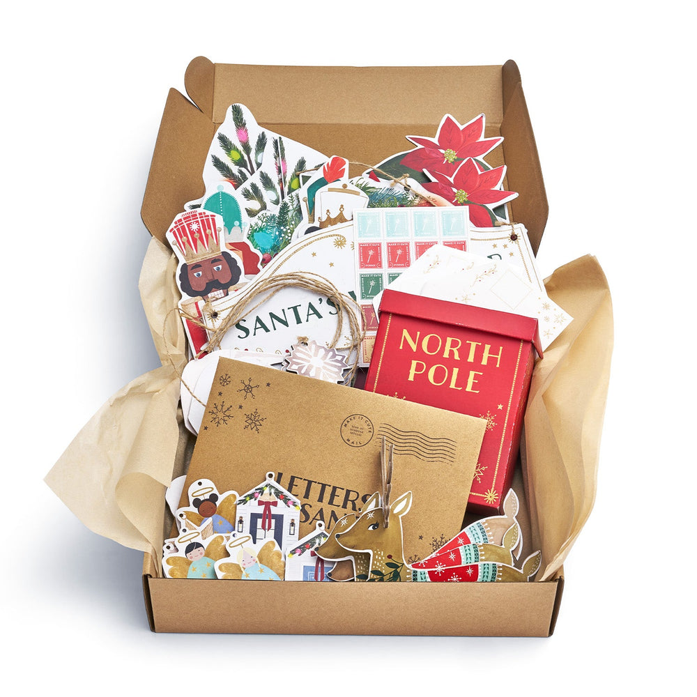 Box of Christmas-themed decor items including cards and a 'Letter to Santa' book.