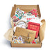 Box of Christmas-themed decor items including cards and a 'Letter to Santa' book.