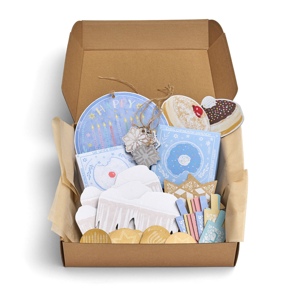 Open cardboard box containing decorative items for Hanukkah.