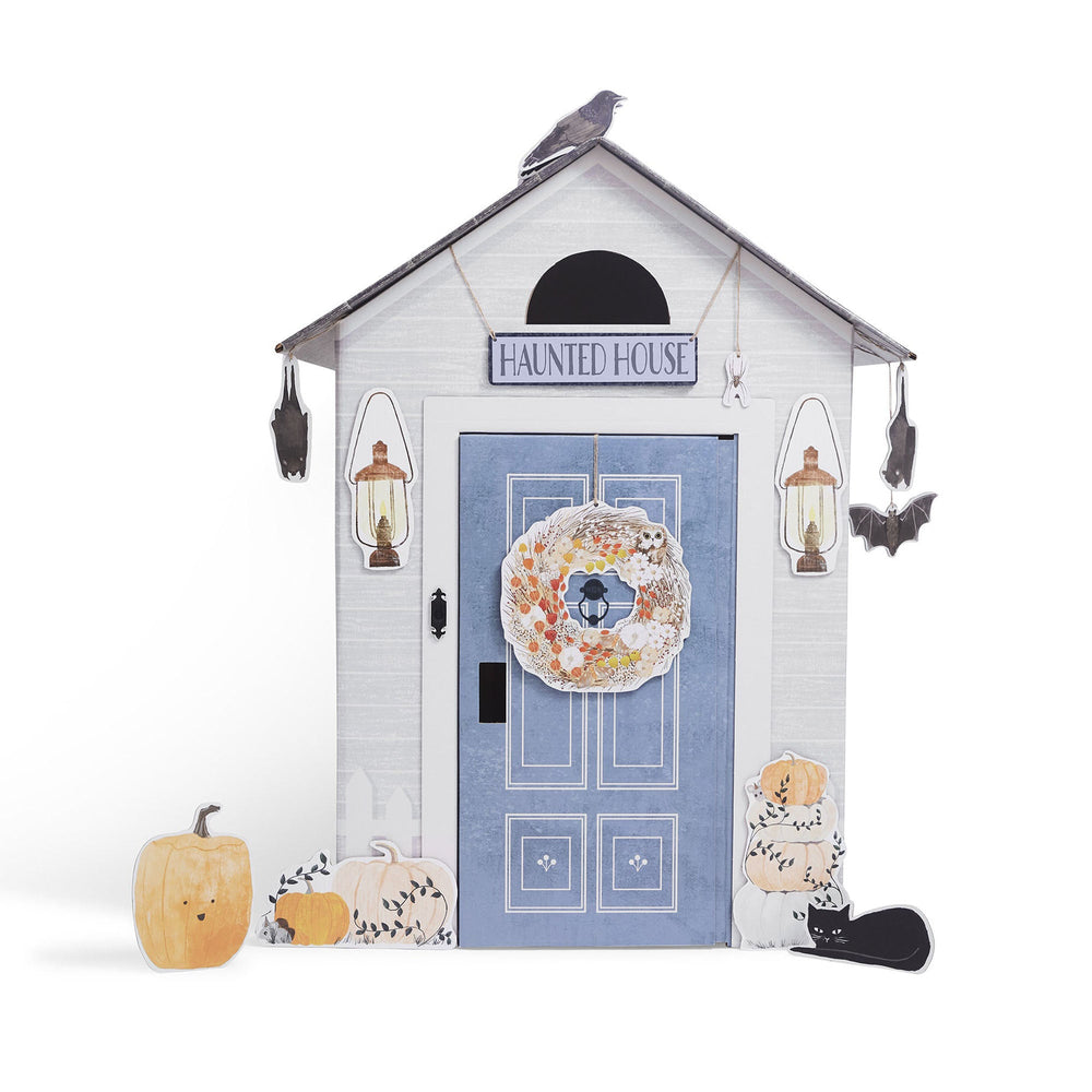 Halloween-themed play house with pumpkins and decorative elements on a white background