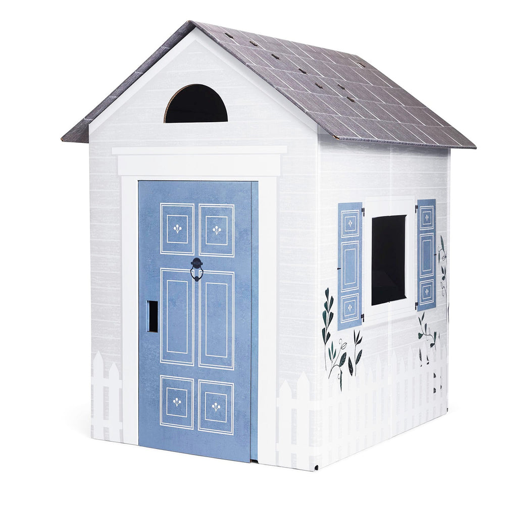 White playhouse with a blue door and shutters on a white background