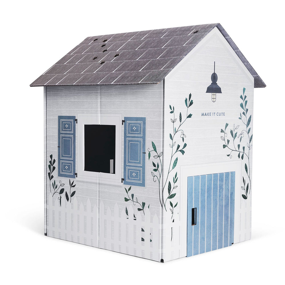 Children's playhouse with white walls, blue shutters, and decorative elements on a white background