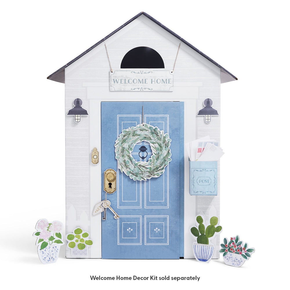 Decorative play house with a blue door and 'Welcome Home' sign on a white background.
