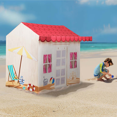 Beach house play tent with red roof on a sandy beach