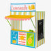 Colorful lemonade stand tent with a striped awning and lemon graphics on a white background