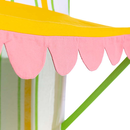 Colorful striped canopy with pink scalloped edge on a white background
