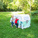 Two children playing with a vintage-style camper tent in a park.