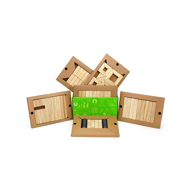 Wooden blocks in an open cardboard box on a white background