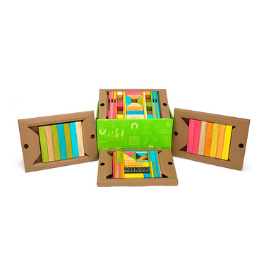 Colorful geometric blocks in a cardboard box on a white background