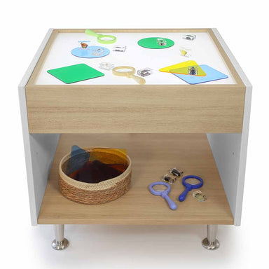 Children's activity light table with educational toys and materials on a white background