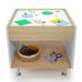 Children's activity light table with educational toys and materials on a white background