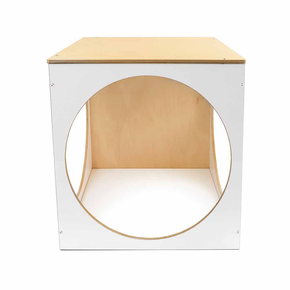 Square wooden play cube with a circular cutout on a white background