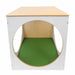Wooden play cube with a green mat on a white background