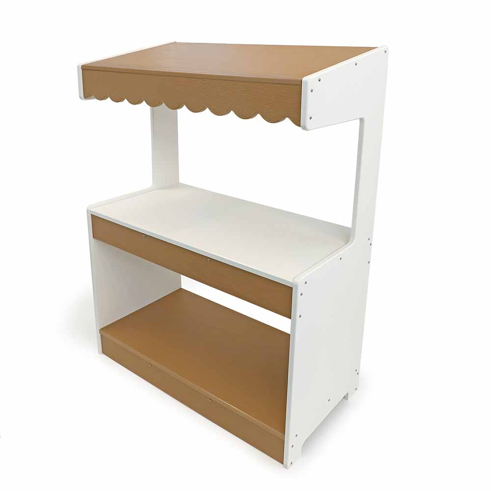 side angle view of outdoor play market stand on white background