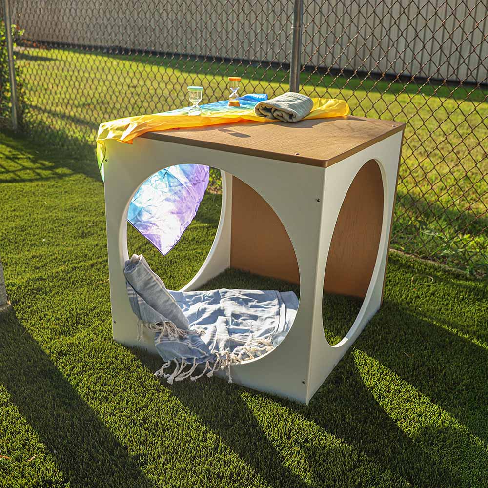 Outdoor play cube on grass