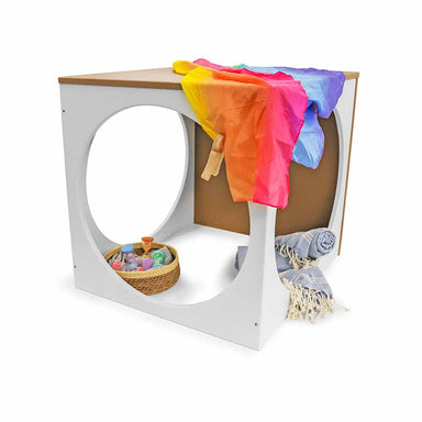 Children's play cube with colorful clothes, and toys on a white background
