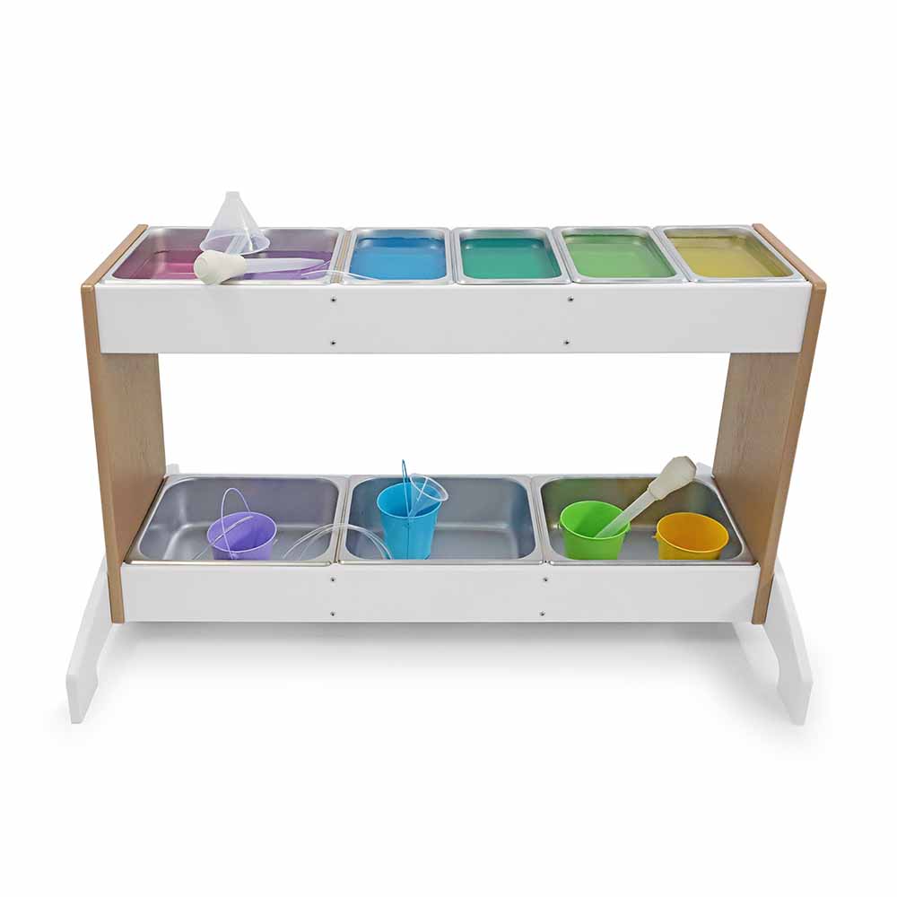 Children's play potion station with various colorful compartments and toys on a white background