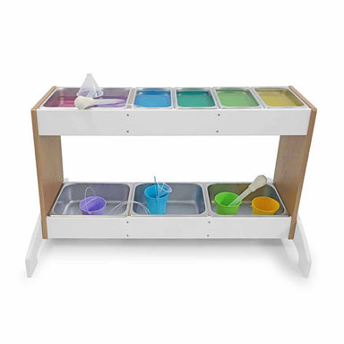 Children's play potion station with various colorful compartments and toys on a white background