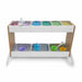 Children's play potion station with various colorful compartments and toys on a white background