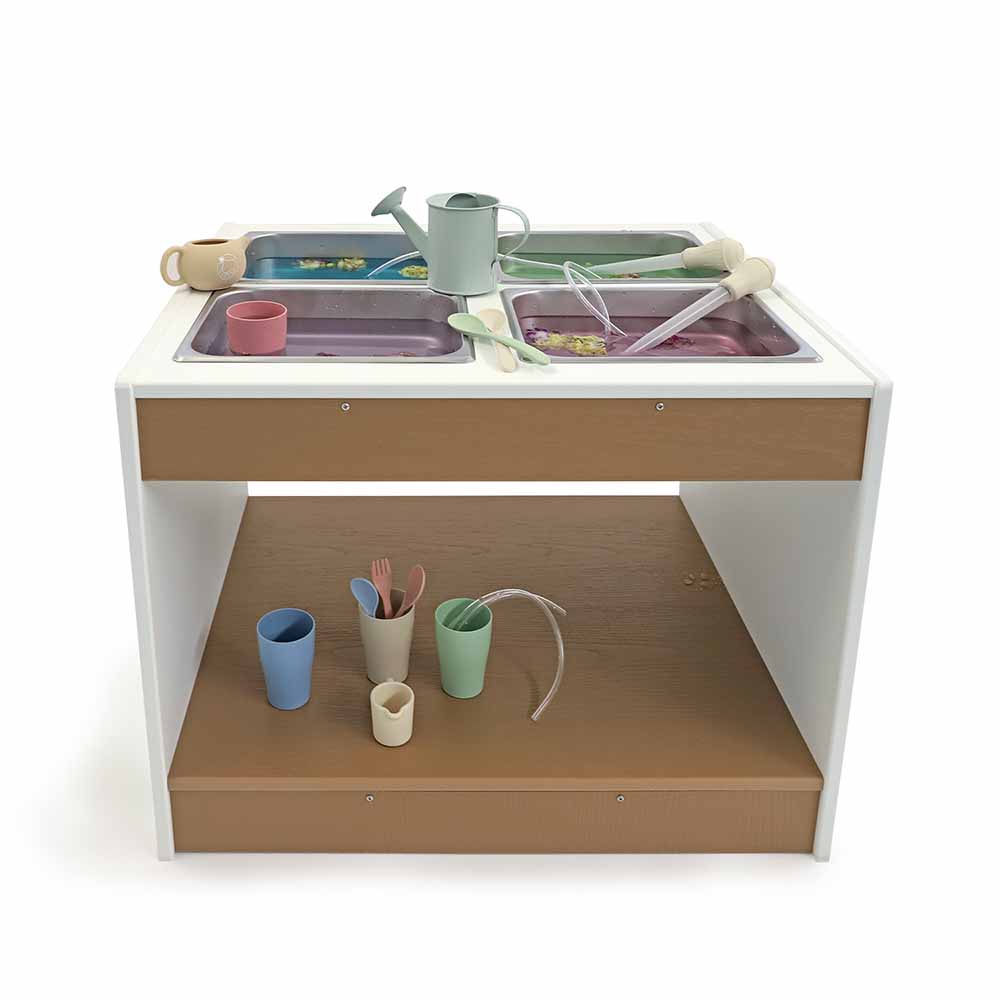 Children's sensory table set with sinks, cups, and utensils on a white background