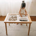 Wonder and Wise Land Sand and Water Table Child Playing with Sensory Bins