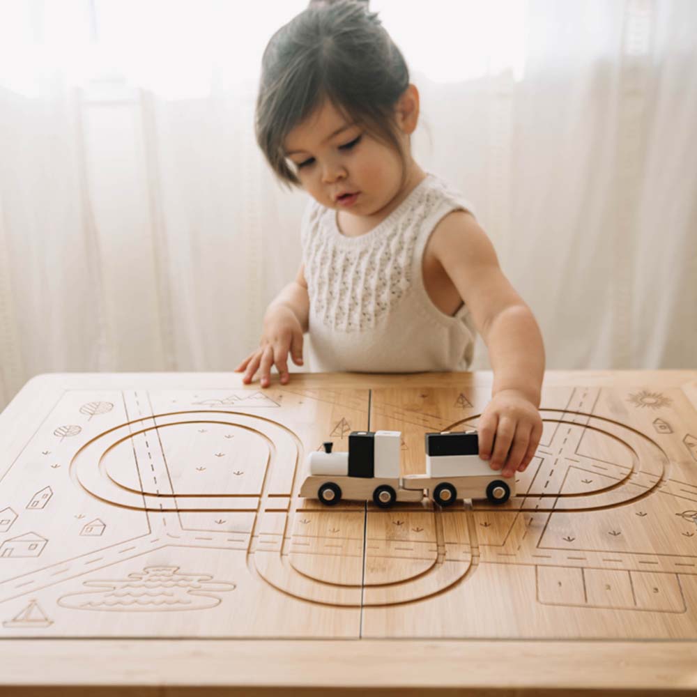 Wonder and Wise Land Sand and Water Table Child Playing with Train Track